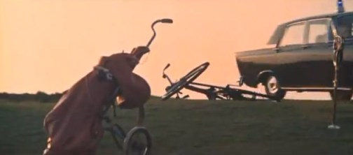 Golf bags under a blood red sky.